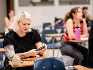 MSU Denver student, Carson Bailey, in looks at a students final project in Egyptian Art class during finals week on May 3, 2023. Photo by Alyson McClaran